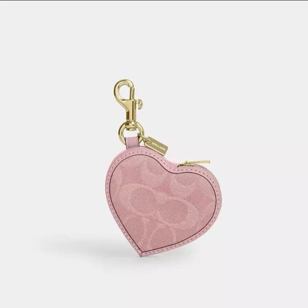 NWT Coach pink Heart Bag Charm
In Signature Denim